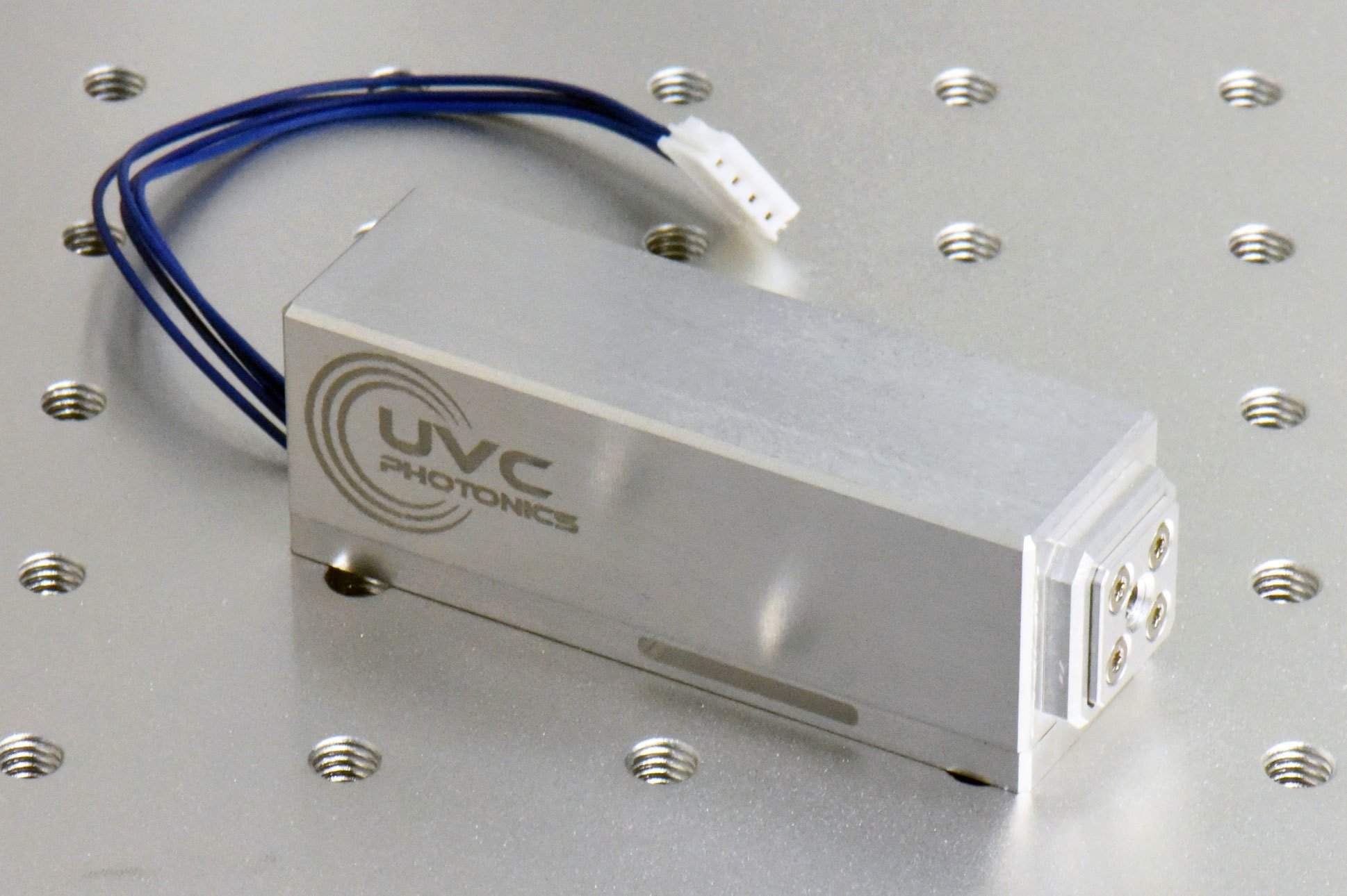 Compact UV lasers from UVC Photonics consist of a blue pump diode, a praseodymium crystal, another crystal for second-harmonic generation (SHG), and a cavity output mirror.2Image courtesy of UVC Photonics.